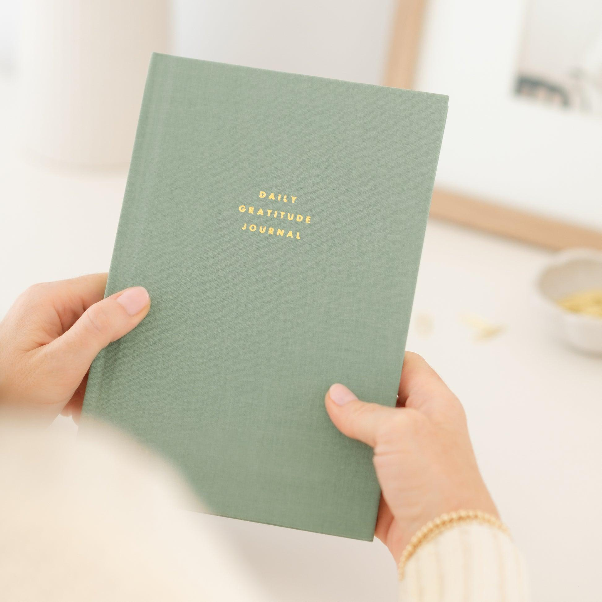 A sage notebook suggesting reflection and planning
